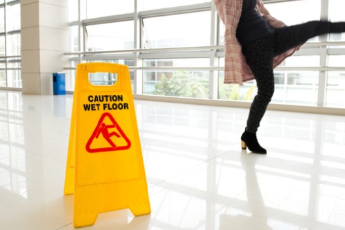 woman slipping wet floor